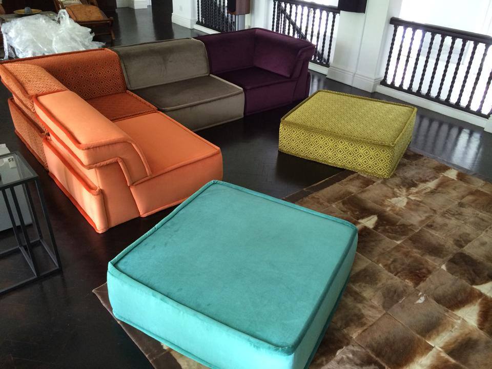 Colourful modular seats in orange, blue, plum and olive